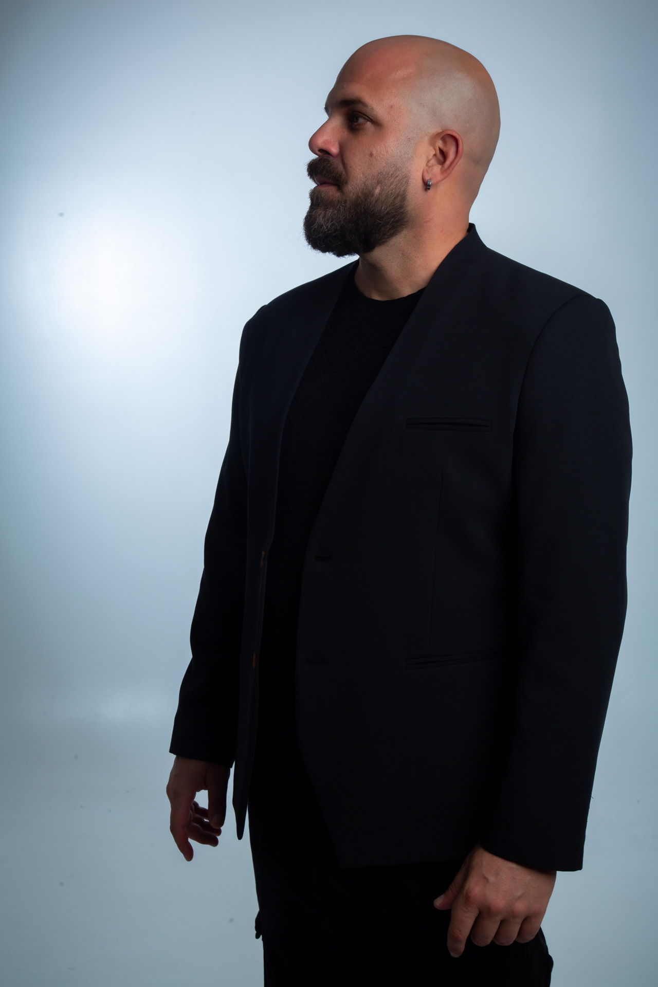 Side studio portrait with jacket