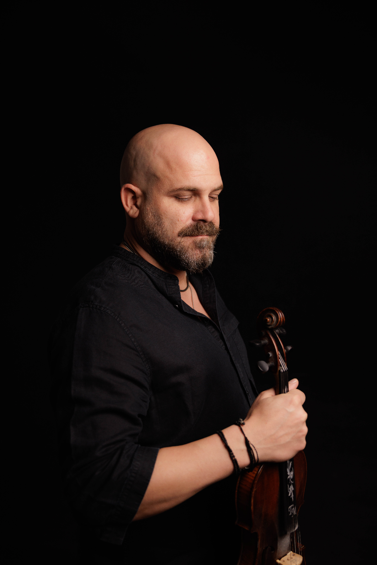 Moment with violin on black background